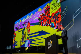 Tour de France Race Director Christian Prudhomme with the 2026 TdF Grand Depart creative during the route reveal event 