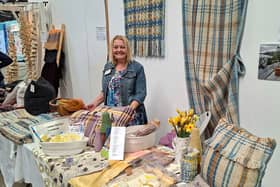 Emma Allin-Thomas with some of her woven, naturally dyed, Welsh yarn products.