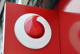 A shop sign for Vodafone mobile in central London
