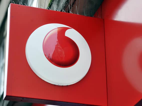 A shop sign for Vodafone mobile in central London