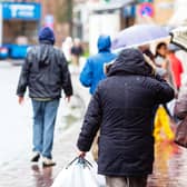 People walking in the city at rain