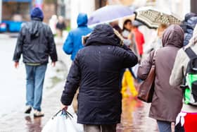 People walking in the city at rain