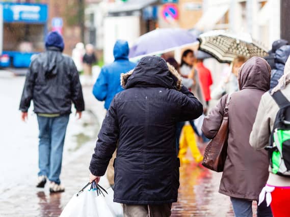 People walking in the city at rain