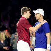 Jack Draper, left, embraces Andy Murray