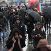 Commuters battle with the wintry conditions on London Bridge