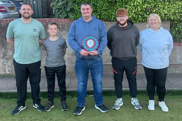 Family Doubles finalists (from left) Scott Simpson & Rowan Fuller, Dave Hughes with the trophy, Joe and Angela Killen