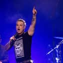 Robbie Williams performs at Aviva Studios in Manchester as part of Brits Week 26 for War Child