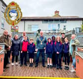 A representative selection of the youngsters who have worked on the tiles for the Croseo site with Builth Wells Mayor Councillor Mark Hammond centre, Deputy Mayor Councillor Alan Waller on the left, Isaac Coe and Alex and Blue Macaskill.