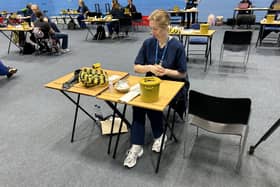 Students receiving vaccines and antibiotics from medical staff in the sports hall at the University of Kent campus in Canterbury