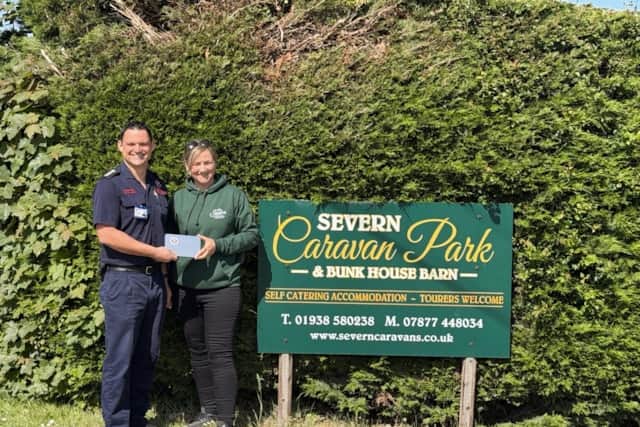 Rachel from Severn Caravan Park receiving their certificate of thanks from the fire service