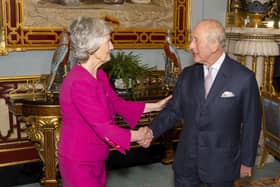 Irish President Catherine Connolly shakes hands with the King