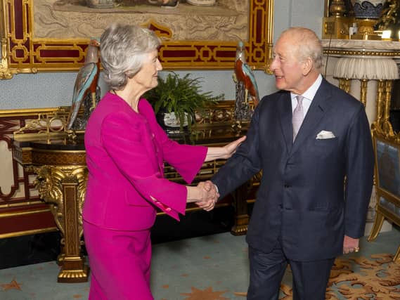Irish President Catherine Connolly shakes hands with the King