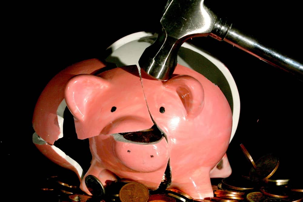 A piggy bank being smashed