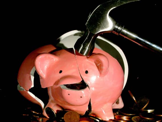 A piggy bank being smashed