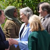 Irish President Catherine Connolly shakes hands with the chief executive of the London Irish Centre Seamus MacCormaic, left, at the London Irish Centre in Camden, north London