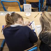 Two young girls working at a desk