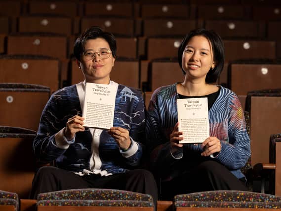 Yang Shuang-zi and Lin King holding copies of Taiwan Travelogue