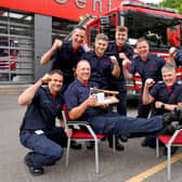 Retiring firefighter Martin Jones, putting his feet up after 30 years of service. He's pictured here with colleagues at Telford Central station.