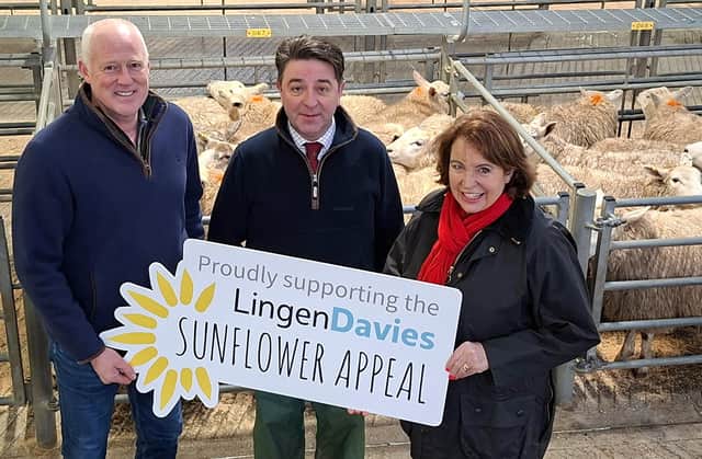 Lingen Davies fundraiser Angela Hill with auctioneer James Evans and Stuart Ashley