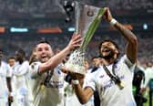 John McGinn and Tyrone Mings of Aston Villa celebrate while holding the UEFA Europa League trophy 