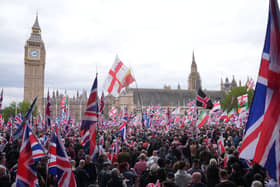 People take part in Tommy Robinson’s Unite the Kingdom march in central London