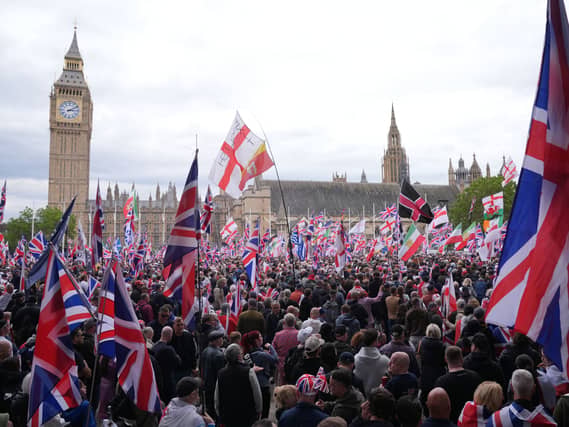 People take part in Tommy Robinson’s Unite the Kingdom march in central London