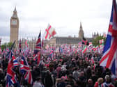 People take part in Tommy Robinson’s Unite the Kingdom march in central London