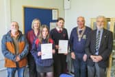 (L-R) Rotarian Ciaran O’Connell, Head of English: Anwen Nicholls,  Martha Jones, Matilda Batten, Rotary President Hugh Garner, and Rotarian Arthur Harries