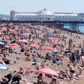 A view of the beach as people enjoy the hot weather in Brighton, East Sussex