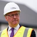 John Swinney wearing a hard hat and wearing a high-vis jacket