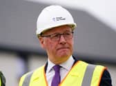 John Swinney wearing a hard hat and wearing a high-vis jacket
