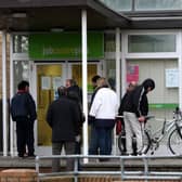 People queuing outside a job centre