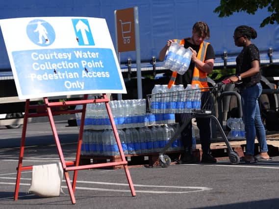 Water bottles being handed out at a water collection point at a Sainsbury’s near Whitstable, Kent