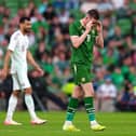 Republic of Ireland’s Jack Moylan leaves the pitch after being shown a red card against Qatar