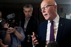 John Swinney speaking to the media