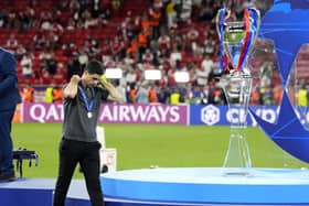 Arsenal manager Mikel Arteta walks past the trophy following defeat