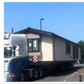 A lorry carrying a caravan caused “chaos” as it was forced to reverse back over a tight bridge.