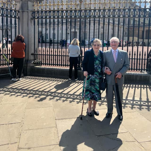 Terry and Babs Seston outside Buckingham Palace