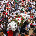Demonstrators carried a coffin