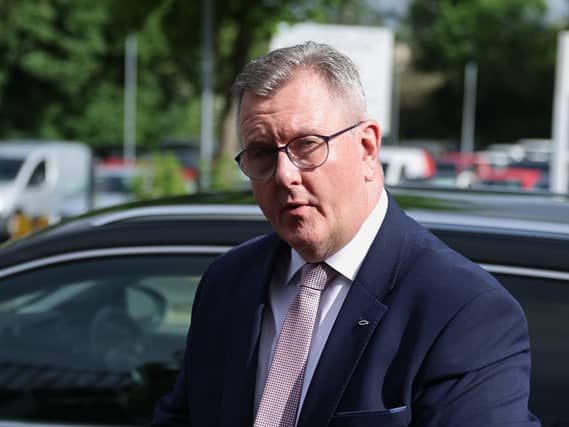 Sir Jeffrey Donaldson gets out of a car