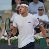 Jakub Mensik holds his racket