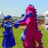 Llandrindod Wells Town Crier Jan Swindale enjoyed a dance with a dragon after officially opening Llanbister Show.
