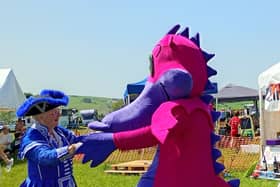 Llandrindod Wells Town Crier Jan Swindale enjoyed a dance with a dragon after officially opening Llanbister Show.