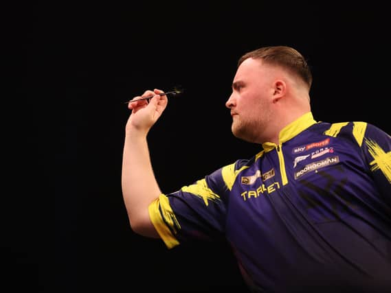 Luke Littler in darts action