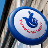 Close up of The National Lottery Lotto sign outside a shop