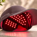 The Beauty Pie All Systems Grow H-Wave LED Hair & Scalp Treatment Cap uses 125 red LED lights designed to support healthier hair growth and reduce shedding through low-level light therapy