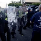 Police and protesters clashing in Southampton during a protest following the death of Henry Nowak