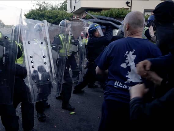 Police and protesters clashing in Southampton during a protest following the death of Henry Nowak