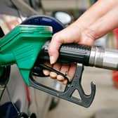 Woman Filling a Car with Unleaded Petrol
