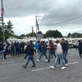 PSNI officers in riot gear with armoured vans monitor counter protesters in Scarva, Co Down, during a pro-Palestinian march from Lurgan to Newry that will pass through the villag